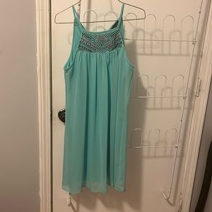 Like new condition. Nice light material with neck tie fastener